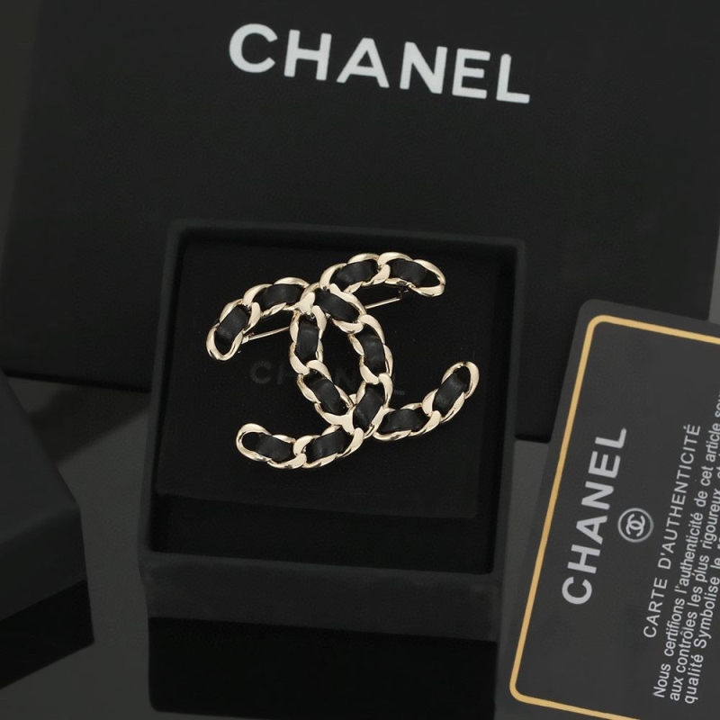 Ch*el brooches